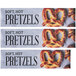 A white decal with the words "soft hot pretzels" and a close-up of a pretzel.