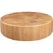 An Elite Global Solutions round faux wood melamine riser with a checkered pattern on a wooden table.