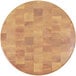 A round faux wood melamine riser with a patterned surface.