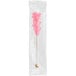 A pink and white Roses Dryden and Palmer cherry rock candy stick in clear packaging.
