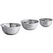 A group of three silver stainless steel mixing bowls.
