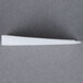 A translucent white plastic Wobble Wedge on a gray surface.