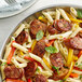 A bowl of pasta with Regal Hot Italian Sausage and peppers.