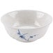 A white bowl with blue bamboo designs on it.