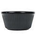 A black fluted ramekin with a ribbed pattern.