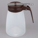 A Tablecraft polypropylene syrup dispenser with a brown plastic lid and handle.