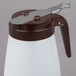 A Tablecraft white and brown polypropylene syrup dispenser with a brown lid and handle.