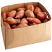 A box of fresh sweet potatoes.