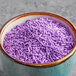A bowl of Bake-Stable Purple Sprinkles.