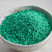A bowl of Bake-Stable Green Sprinkles.
