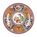 A close-up of a Thunder Group Peacock melamine plate with colorful floral designs.