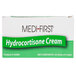 A white box with green and black text for Medique Hydrocortisone cream packets.