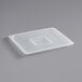 A translucent polypropylene plastic lid with a square opening on a plastic container.