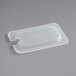 A translucent plastic lid with a notch on a plastic container.