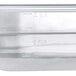 A close-up of a translucent plastic Vigor food pan.