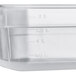 A translucent polypropylene food pan with measurements on the side.