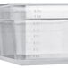 A translucent plastic container with measurements on it.
