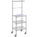 A Regency chrome wire shelving unit with three shelves on wheels.