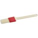 A natural bristle pastry and basting brush with a white plastic handle.