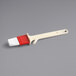 A white and red plastic Choice pastry and basting brush.