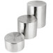 A Tablecraft stainless steel nesting riser set with three cylindrical risers.