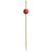 A wooden toothpick with a red ball on top.