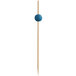 A wooden stick with a blue ball on top.