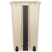 A beige rectangular trash can with black accents.