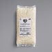 A white package of Follow Your Heart Dairy-Free Vegan Shredded Mozzarella Cheese with black text.