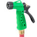 A red Notrax commercial hot water hose with a black and green garden hose nozzle.