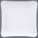 A white square plate with spiral pattern.