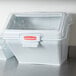 A white Rubbermaid ingredient storage bin with a clear sliding lid.