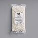 A case of Follow Your Heart Dairy-Free Vegan Crumbled Feta Cheese bags on a white surface.