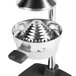 A silver stainless steel cone for a Choice Manual Juicer on a metal stand.