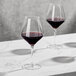 Two Della Luce Astro red wine glasses on a table