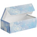 A blue candy box with white snowflakes on it.