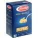 A blue box of Barilla Mini Wheels pasta with a label of pasta.