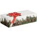 A white candy box with a red bow and green berries print.