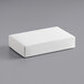 A white rectangular 2-piece candy box on a gray surface.