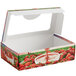 A white windowed chocolate covered strawberry box with a picture of strawberries and chocolate.