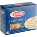 A blue Barilla box of jumbo shells pasta with a picture of pasta shells on it.