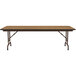 A Correll rectangular folding table with a oak top and brown metal legs.