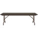 A Correll rectangular folding table with a walnut top and brown legs.