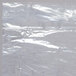 A roll of 54" plastic garment bags with white text on it.