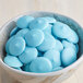A bowl of blue candies with Alpine Blue Vanilla Coating Wafers.