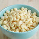 A bowl of Regal Foods white chocolate chips.