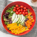 A red GET Red Sensation catering bowl filled with vegetables and greens.
