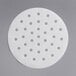 A white 6" circular patty paper with perforations.