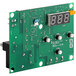 A green circuit board with white buttons and a digital display.