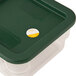 A white plastic container with a green lid filled with Noble Products Tuesday 1" Removable Day of the Week labels.